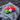 Collection of colored golf balls on a gray towel with a blurred wood background