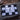 Black and white checkered flag with a black course logo on a wooden surface.