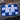 Blue and white checkered flag with a black course logo on a wooden surface.
