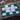 Green and white checkered flag with a black course logo on a wooden surface.