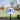 White dad hat embroidered with the 1952 logo on a stand with a golf course blurred background